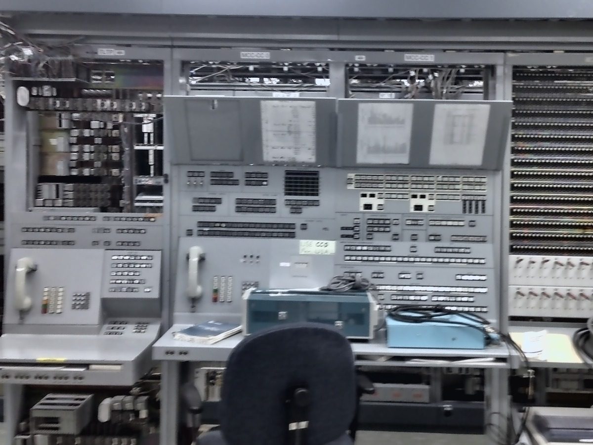 A Western Electric central office Master Control and Alarm panel with rows of indicator lamps, alarm keys, and open wire-wrap bays behind it.
